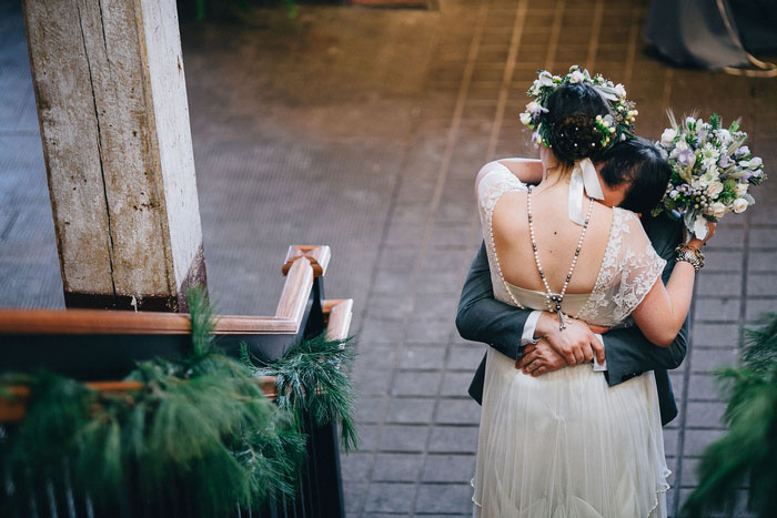 bride and room hugging