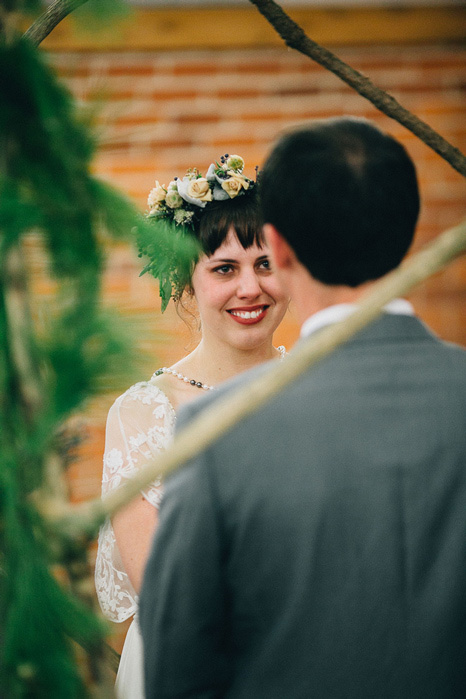 bride smiling at groom during ceremony