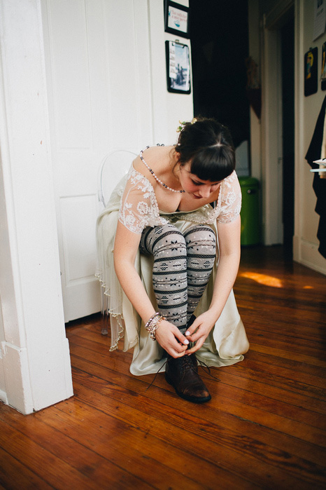 bride lacing up boots