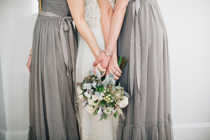 bride and bridesmaids holding bouquets