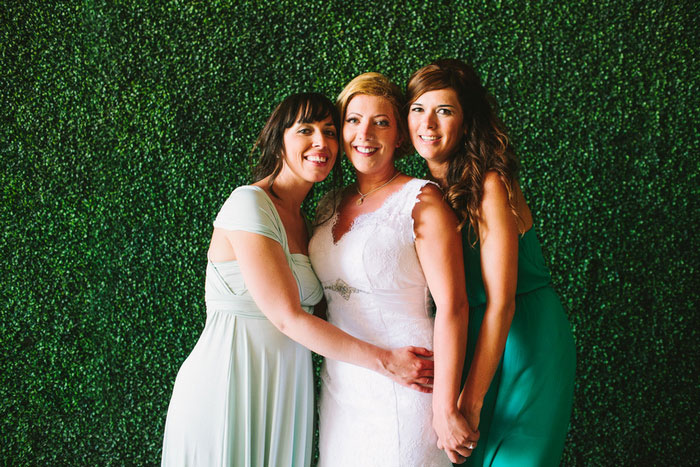 bride's with bridesmaids in green