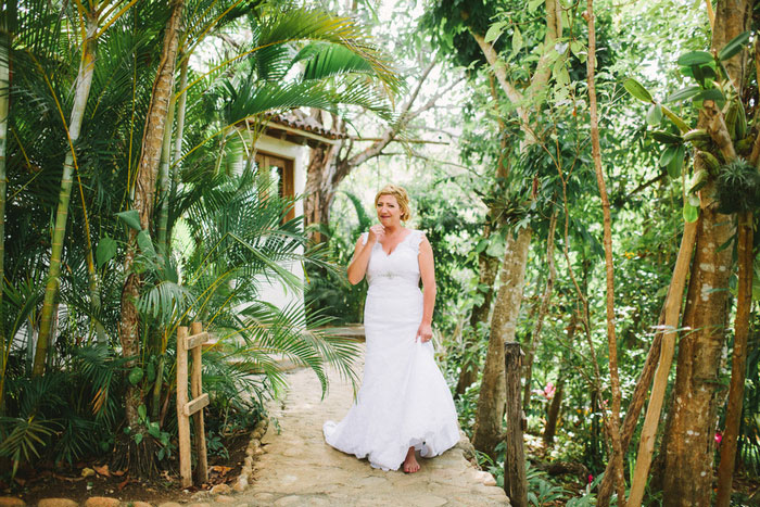 emotional bride walking to meet her father