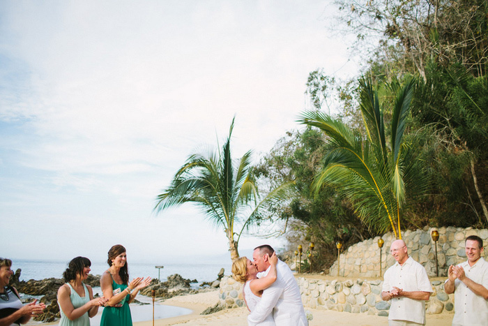 bride and groom first kiss