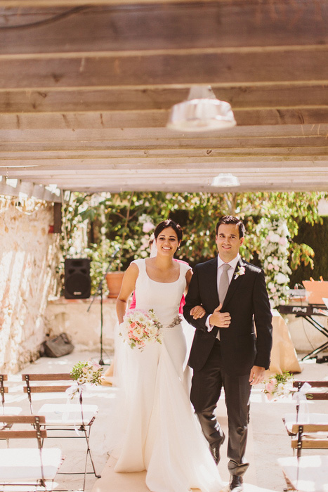 bride and groom walking down the aisle