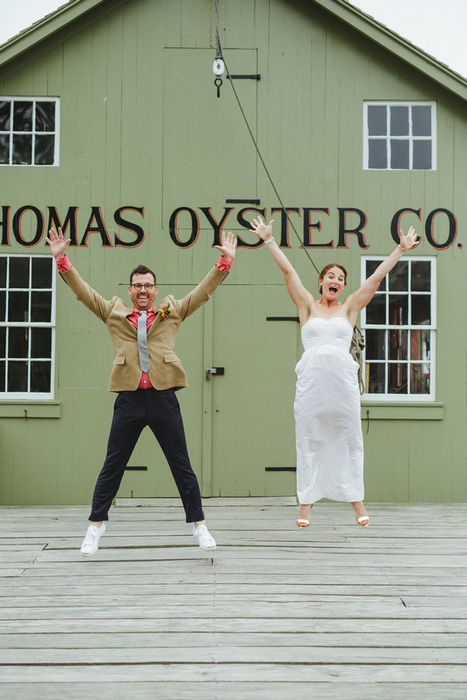 bride and groom jumping