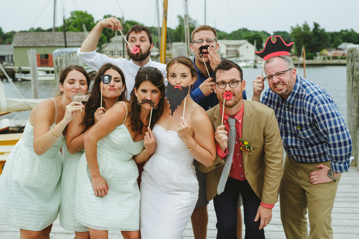 bridal party with photo booth props