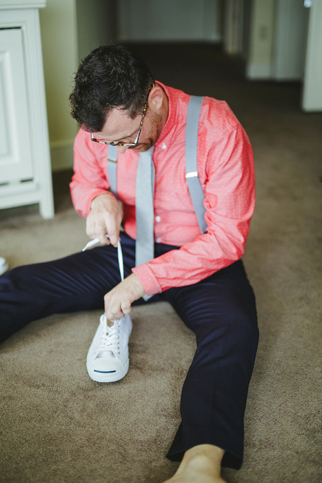 groom putting on his shoes