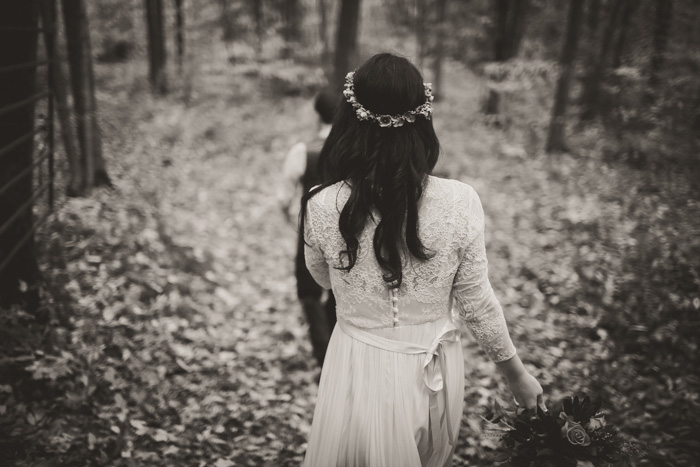 bride walking through the woods