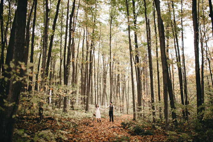 bride and groom in the woods