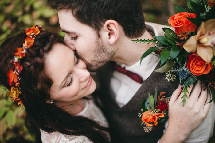 groom kissing bride's cheek