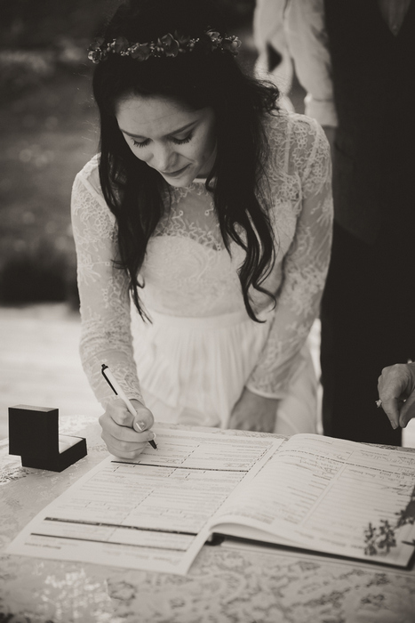 bride signing marriage certificate