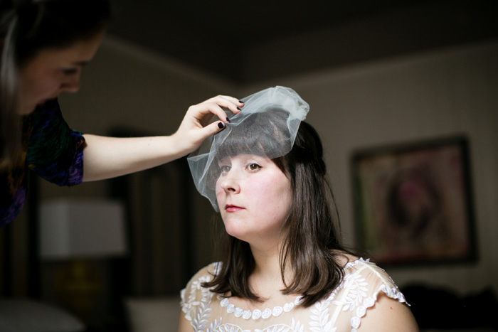 bride putting on her veil