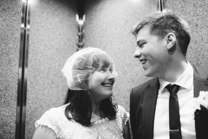 bride and groom in elevator