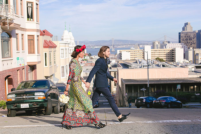 bride and groom crossing San Francisco street