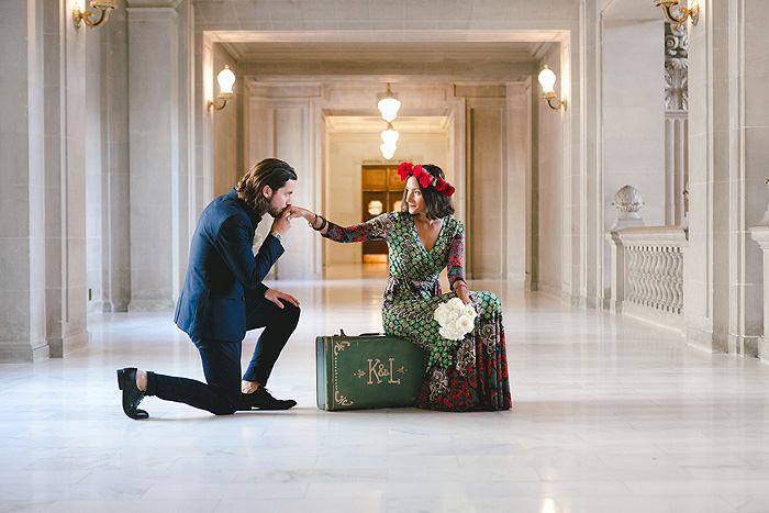 groom kissing bride's hand