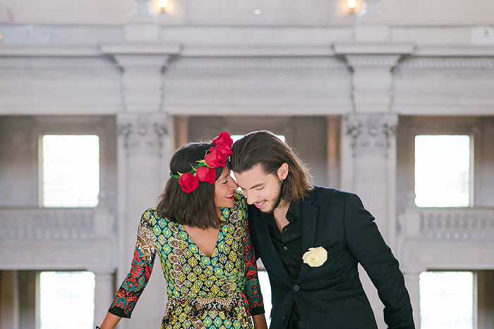 bride whispering in groom's ear