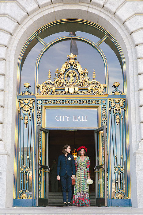 bride and groom in city hall doorway