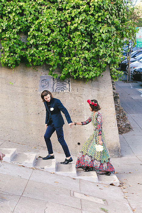 bride and groom walking up San Francisco street