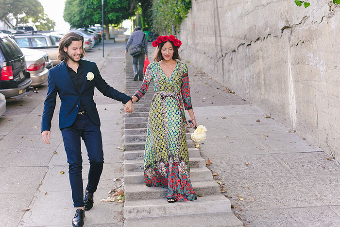 bride and groom walking down San Francisco street