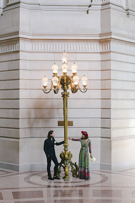 bride and groom inside San Francisco City Hall