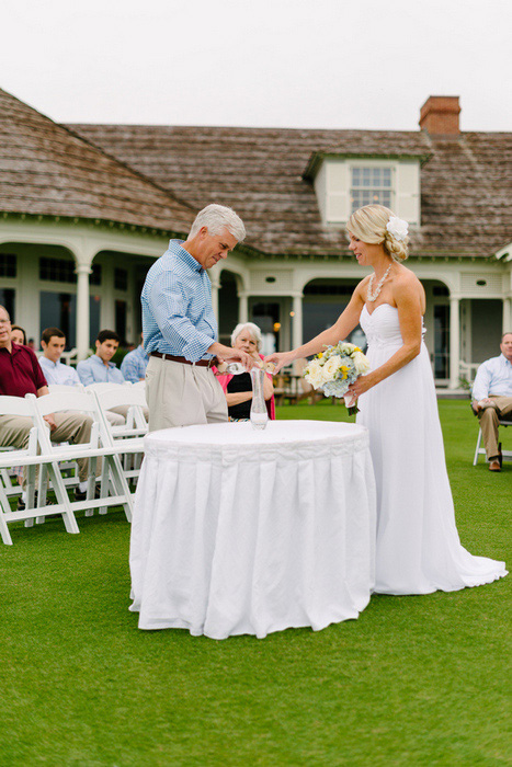 bride and groom pouring sand during ceremony