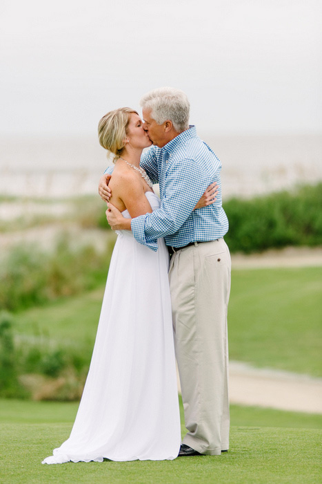 bride and groom first kiss