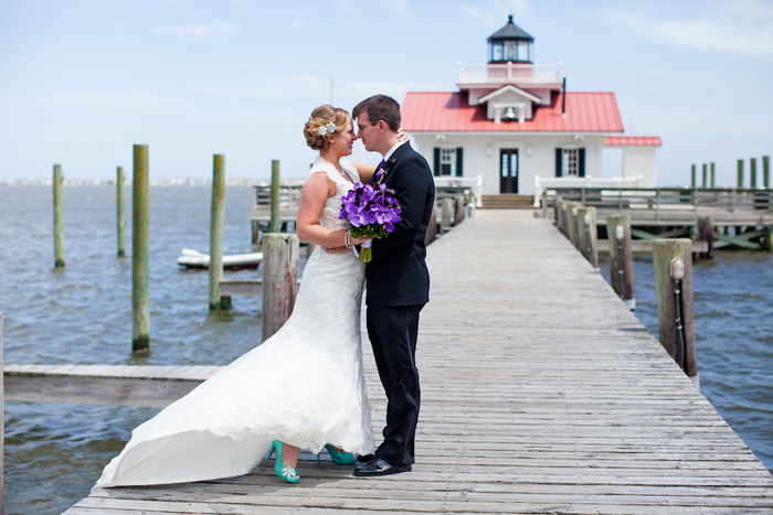 bride and groom on the pier