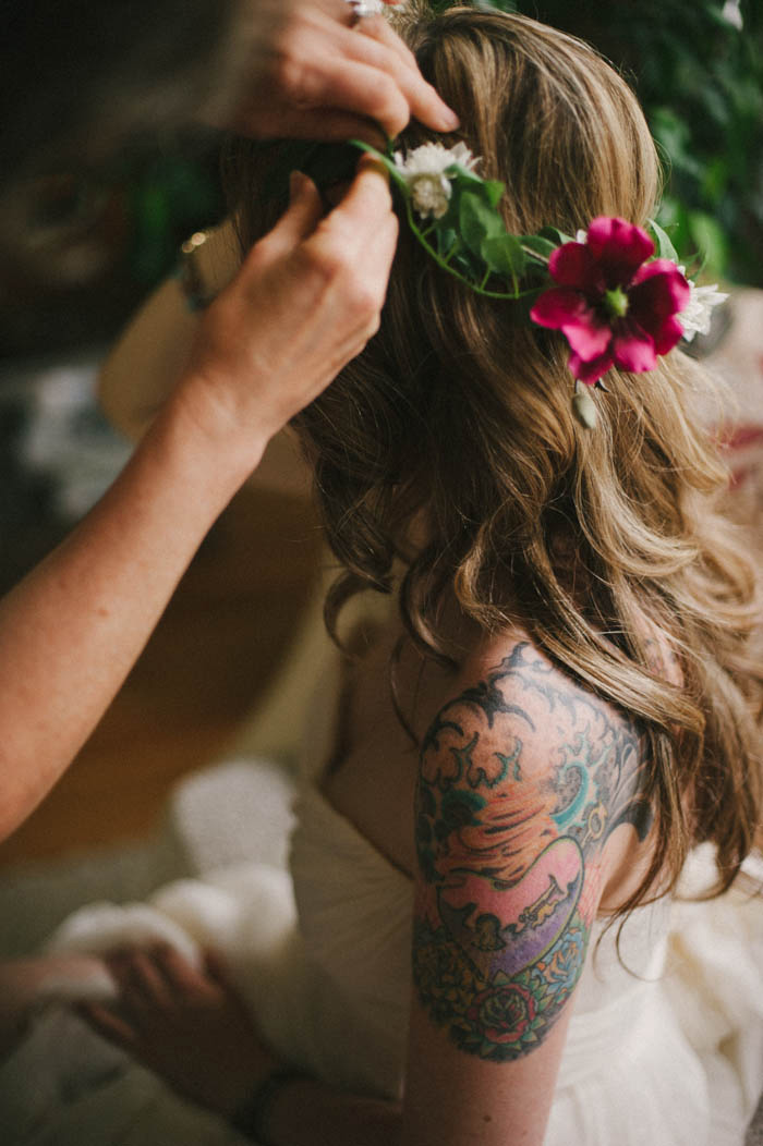 bride having her flower crown put on