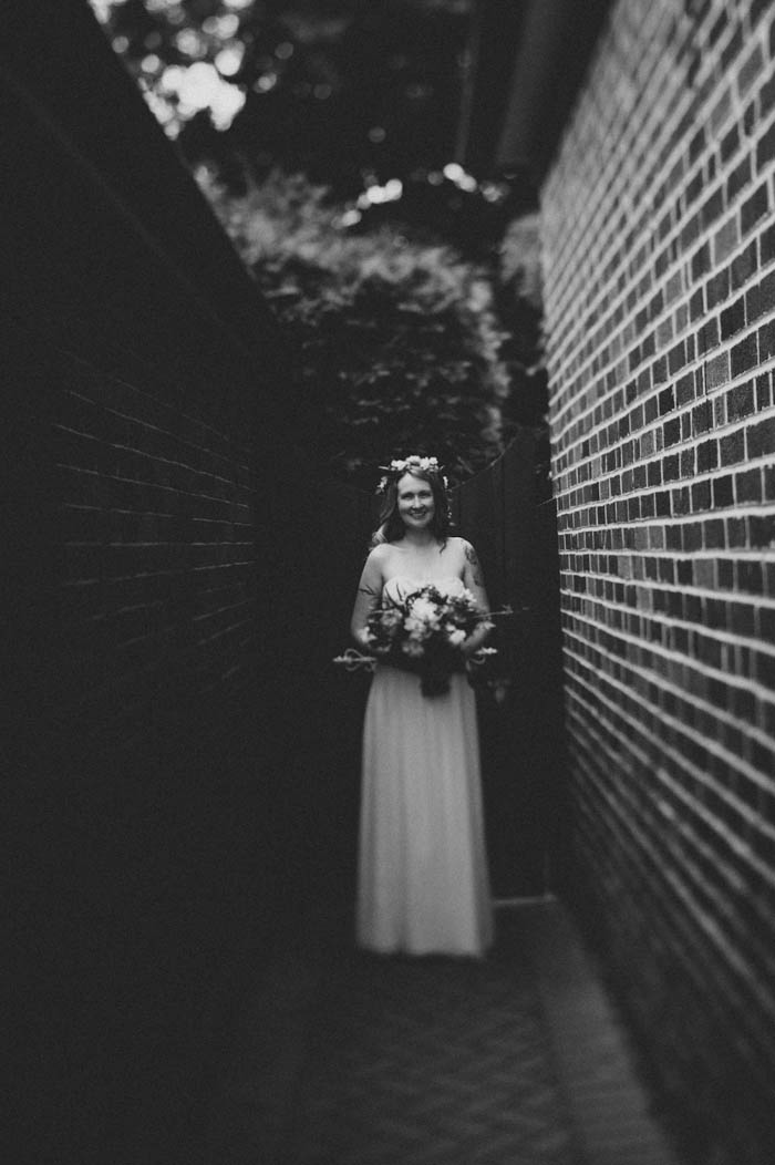 bride portrait by side of house