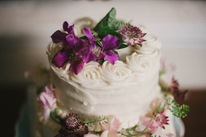 wedding cake topped with real flowers