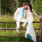 Mountain-Springs-Lodge-Plain-WA-bride-and-groom-on-fence thumbnail