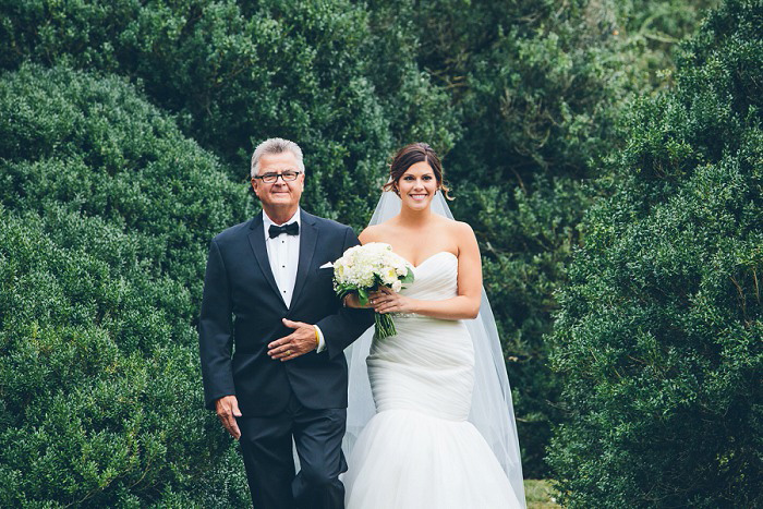 bride walking down the aisle with her dad