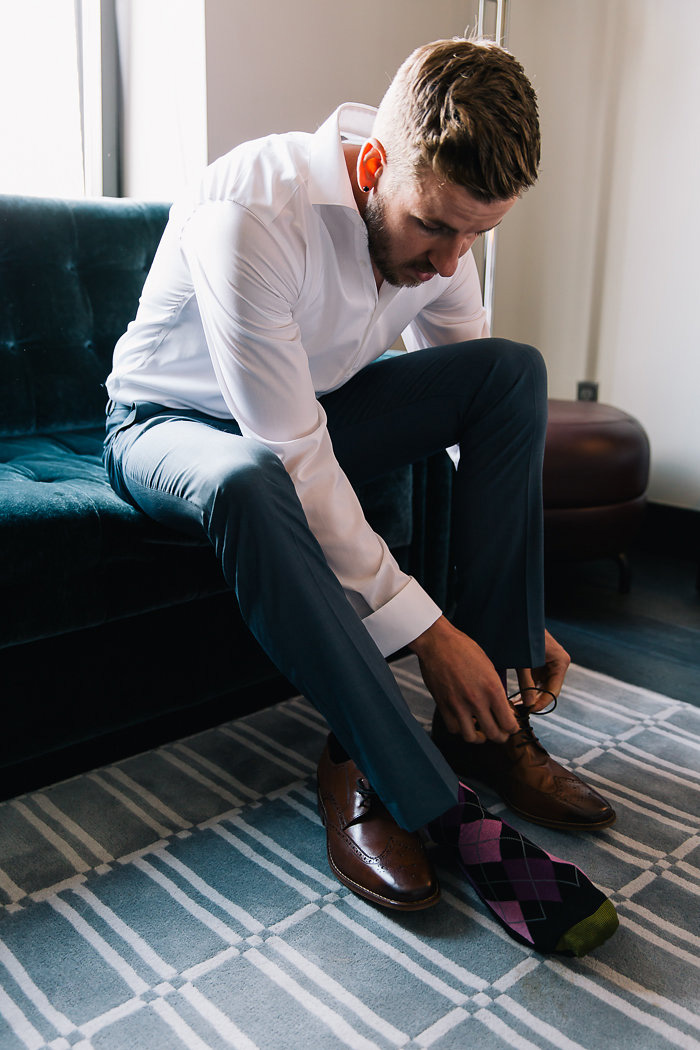 groom tying his shoes