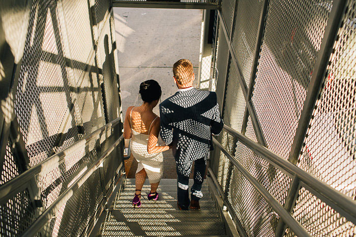 bride and groom walking down stairs