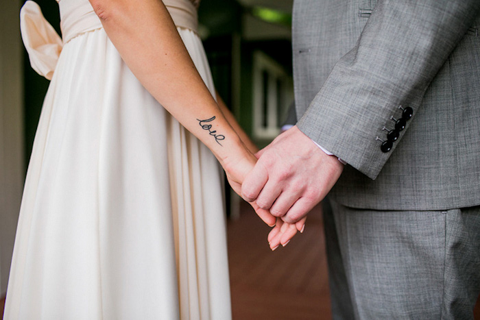 bride and groom holding hands