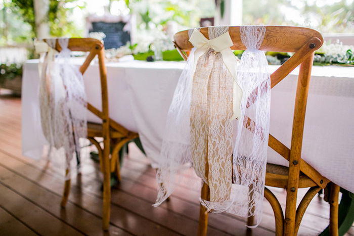 reception chairs decorated with tulle