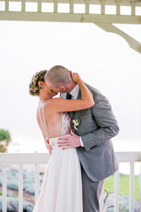 bride and groom first kiss