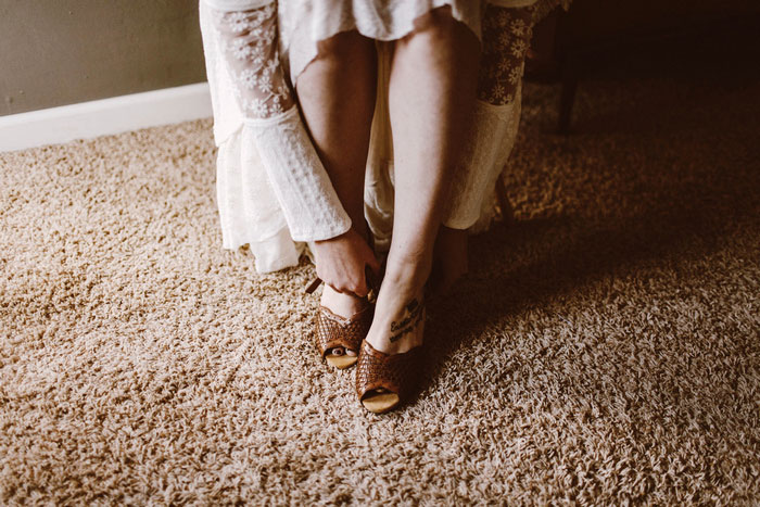 bride putting on shoes