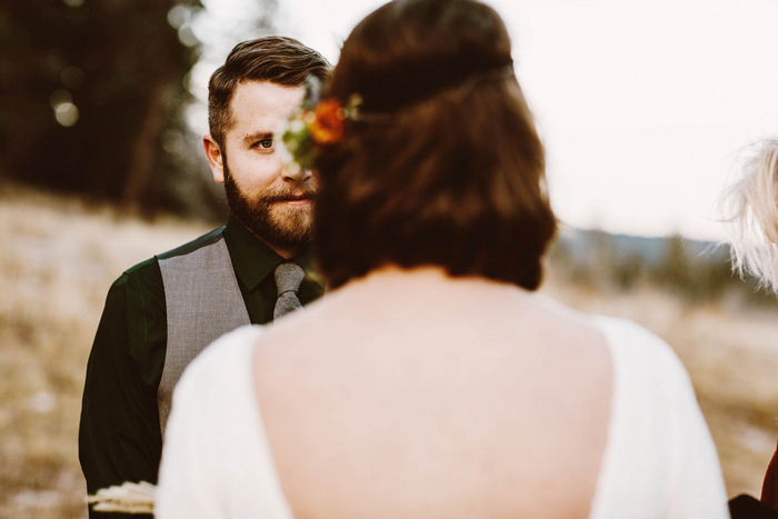 groom looking at bride during ceremony