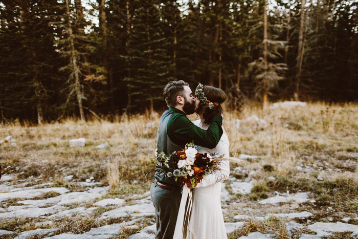 bride and groom first kiss