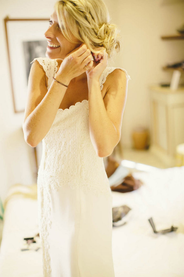 bride putting on earring