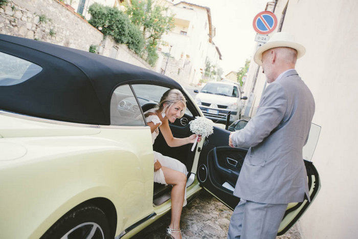 bride getting out of car