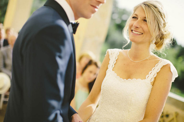 bride looking at groom during ceremony