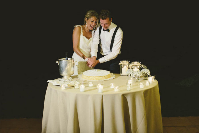 bride and groom cutting the cake