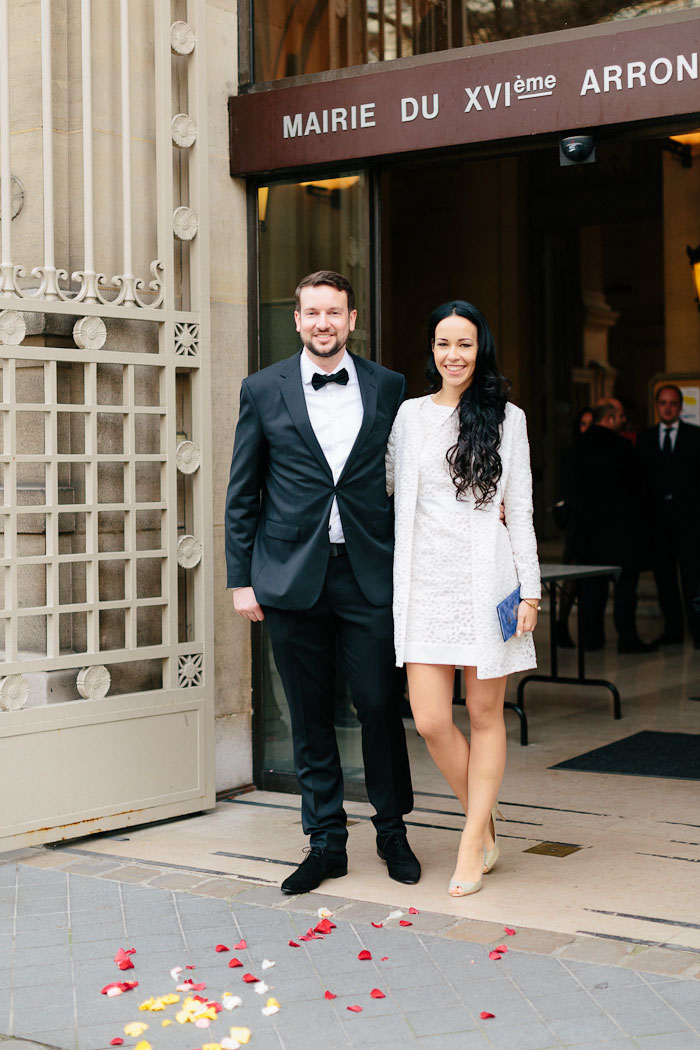 bride and groom exiting city hall