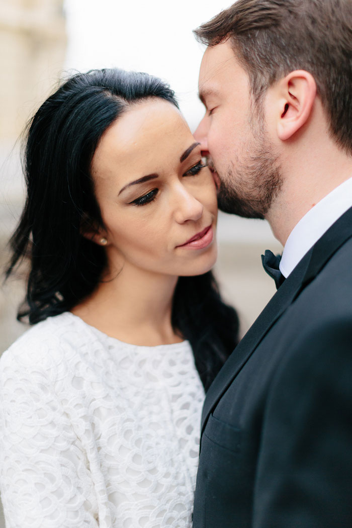 groom kissing bride's cheek