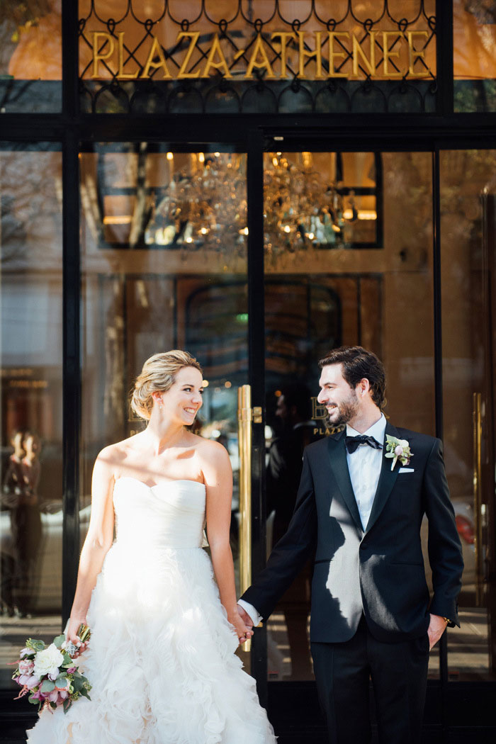 bride and groom outside Paris hotel