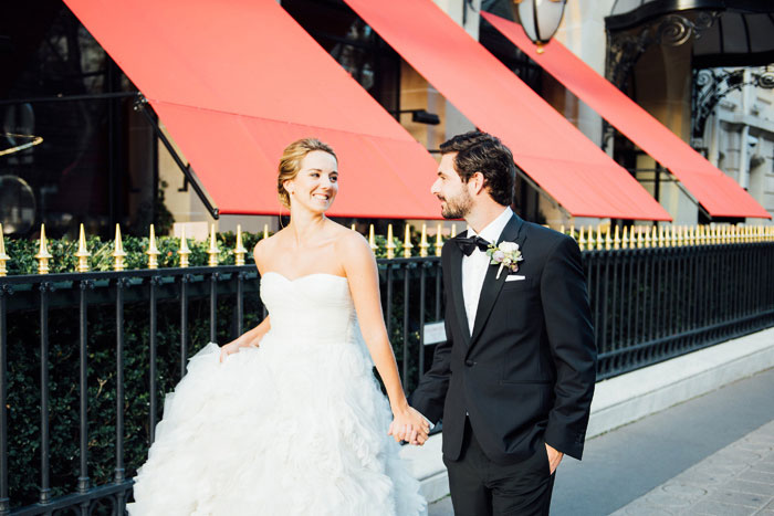bride and groom walking down Paris streets
