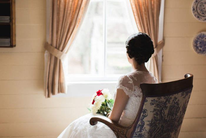 bride sitting by window