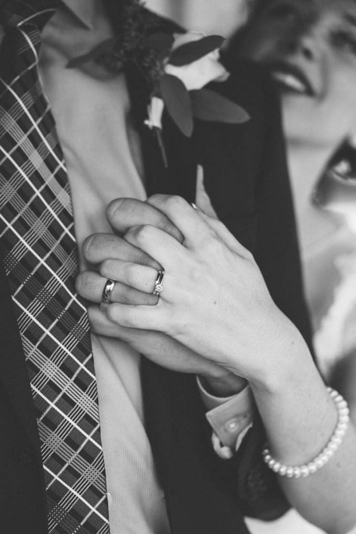 Bride and groom holding hands